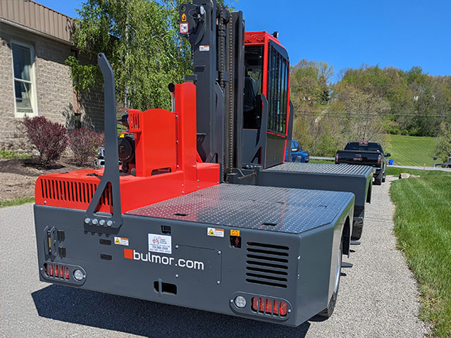 Long pipe, wood or other materials transported safely and with stability using a new  Bulmor Sideloader from Langer Material Handling